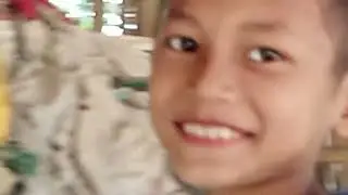 a cute little girl is combing