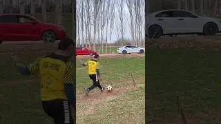 This boy kicks a football and the ball goes into the car #shorts #amazing