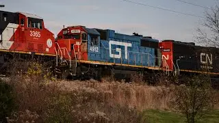 CN 3832 leads CN M337 through Glendale Heights, IL with GTW 4912 trailing on 11/16/2024