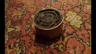 Paraffin candle burner from a trash can