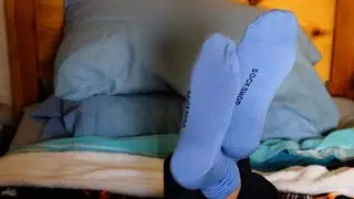 Boy feet in the pose (socks removal)