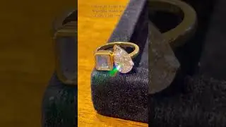 The pear shaped diamond and aquamarine stone studded ring