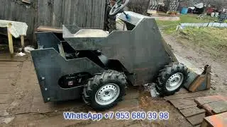 Mini tractor UT-20 4x4 on hydraulic drive. Engine installation. Jaw bucket.