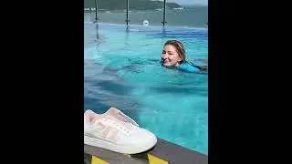 Having fun in wet clothes and wet sneakers in the pool 