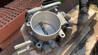 Cleaning the throttle body of a Toyota 2AR-FE engine. Applies to Toyota Camry and RAV4 vehicles.