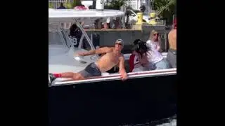 Gronk shoves the Super Bowl trophy up his a**