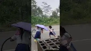 students in the rain