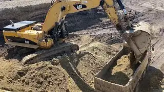 Caterpillar 390D Excavator Loading Mercedes & MAN Trucks - Interkat SA