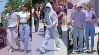 Hailey Bieber flashed her flat abs as she and husband Justin left a cafe.