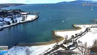 Sunny English Bay Vancouver, after overnight snow on the beach and beautiful blue water