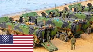 US Marine Amphibious Combat Vehicles (ACV) drive into the sea during an exercise.