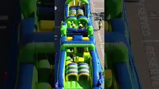 TQL Teams Race in an Inflatable Obstacle Course
