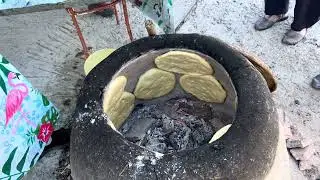 Baking Cabouna breads in the Punic oven