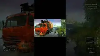 КАМАЗ с бревнами по затопленной местности 