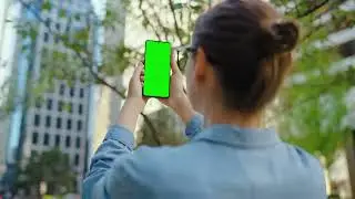 Woman makes a photo by smartphone with green screen Pro Video  stock videos
