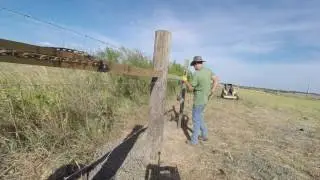 Running & stretching barbed wire fence