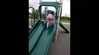 James Cheng and Jacqueline Cheng children playground slide climbing upward