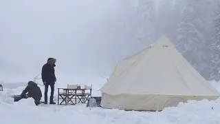 TENT CAMPING BY A FROZEN LAKE IN FREEZING COLD