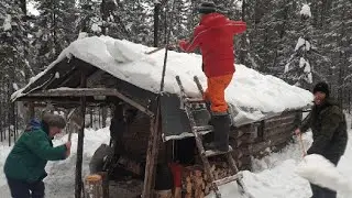 second life of a taiga hut. clearing the roof from snow. hut #1