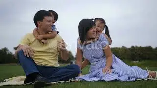 Lovely Asian Family with Siblings Relaxing at Park | Stock Footage - Envato elements