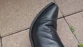 Black cowboy boots and Wrangler jeans