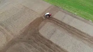 Боронование поля на Т25 самодельными боронами. Видео с дрона.