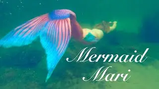 Mermaid Mari swimming in the beautiful clear ocean