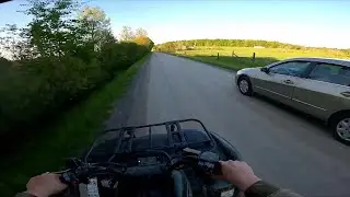 Atv vs Car race on a backroad.