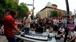 Saxophonist rips a solo on the streets of Harlem with Marc Rebillet