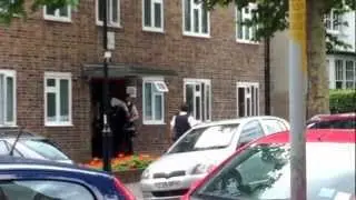 Man gets carried out in huge police raid in Muswell Hill, London