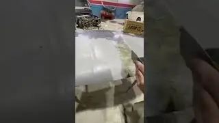 Applying gray putty on hood nicely 