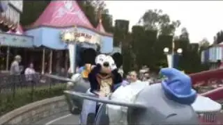 Mickey rides on the Dumbo flying ride　ディズニーランド