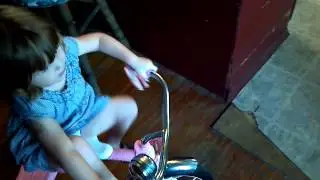 Zoe riding her tricycle singing twinkle twinkle