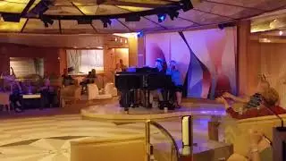 Amanda giving Joey Yates a hand on the piano