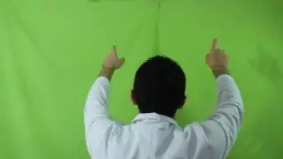 Man performs touch screen gestures against green screen. Tapping, swiping. Stock footage