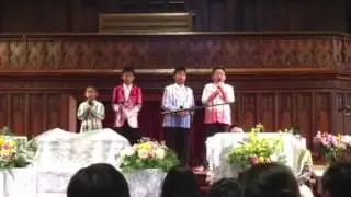 The brothers and cousin singing
