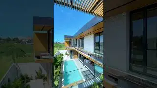 Step into sleek luxury at this striking villa, where modern design meets poolside glam! 
