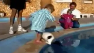 brat tosses cat into swimming pool FAIL