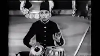 Ustad Ahmedjan Thirakwa playing gats in Teental.