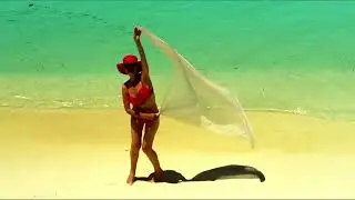 Maldives, Sun Island,  a girl on the beach, honeymoon, shooting from a quadrocopter.  1/4