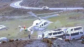 Helicopter Spins Up Towards a Line of Parked Cars