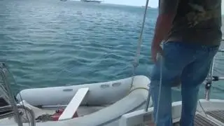 Operating Monet II - Hoisting the Dinghy