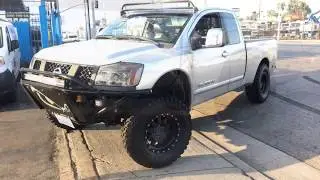 CUSTOM NISSAN TITAN TRUCK LIFTED RIDING 35