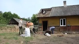 Start of renovation of a rustic log house in the forest. Alone in the pouring rain in a hut