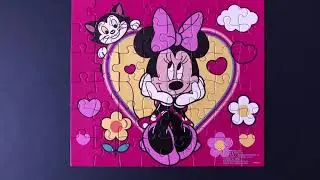 Minnie Mouse puzzle. Assembling with dad