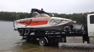 Mikes boat on tow truck