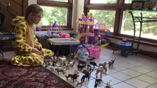 Giraffe Vika playing with her animals.