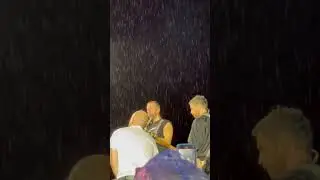 Coldplay performing 'Sparks' in the rain