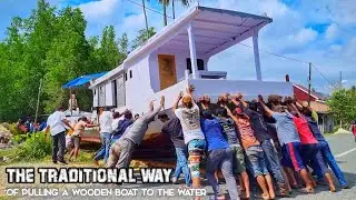 Unique tradition !!!  LAUNCHING OF WOODEN SHIP - Pulled by hundreds of human power.