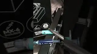 Applying 0.8g Arctic MX6 thermal paste from the Liquid Freezer III kit. 